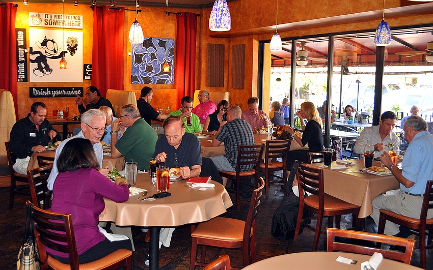Members of YES enjoy some lunch before having their meeting, Tuesday, March 13, at Clayton's Grille.