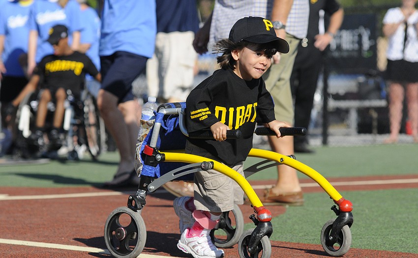 Six-year-old Emma Howey raced down the first base line.