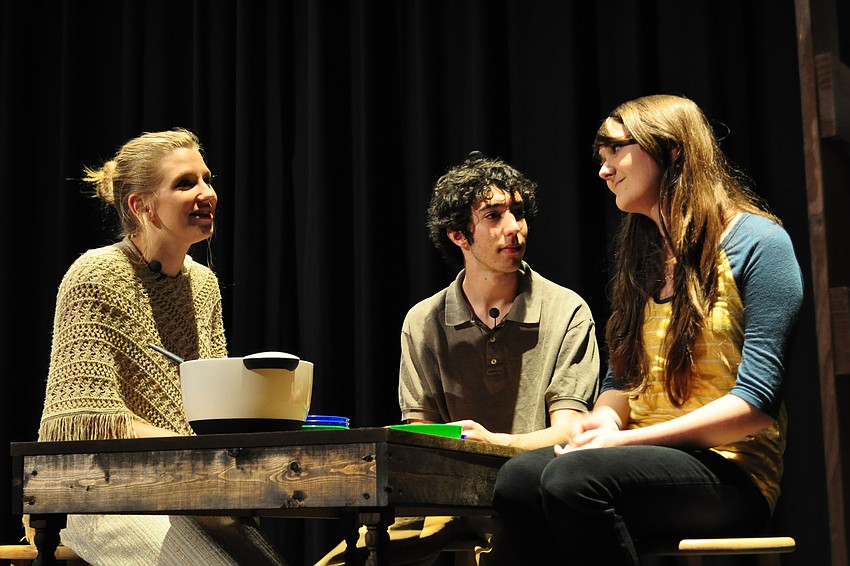 Mrs. and Mr. Bucket, played by Lydia Scheufler and Colin Diener, talk with their daughter Charlie, played by Nikki  LaSalla, about the day.