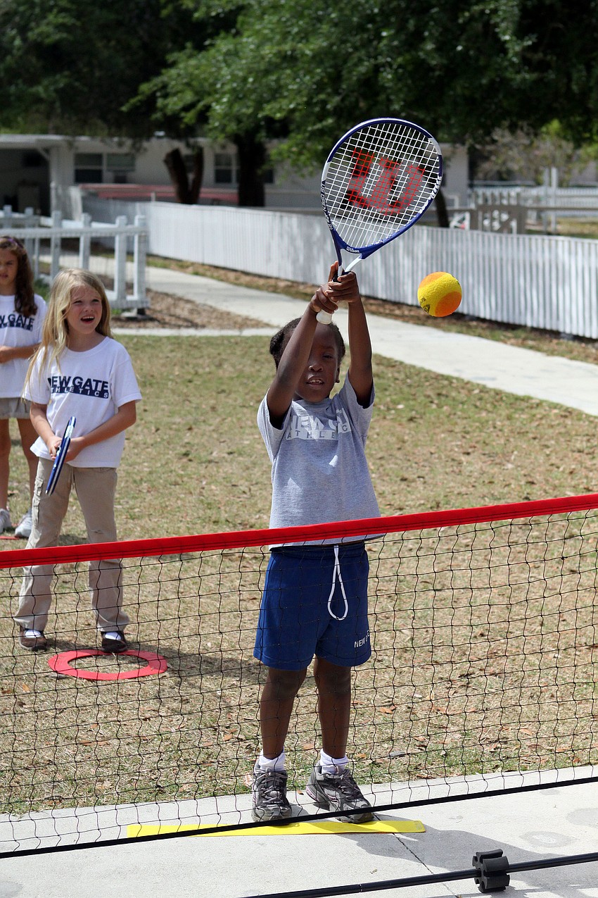 Victoria Kishoiyian, 7, hits a volley.