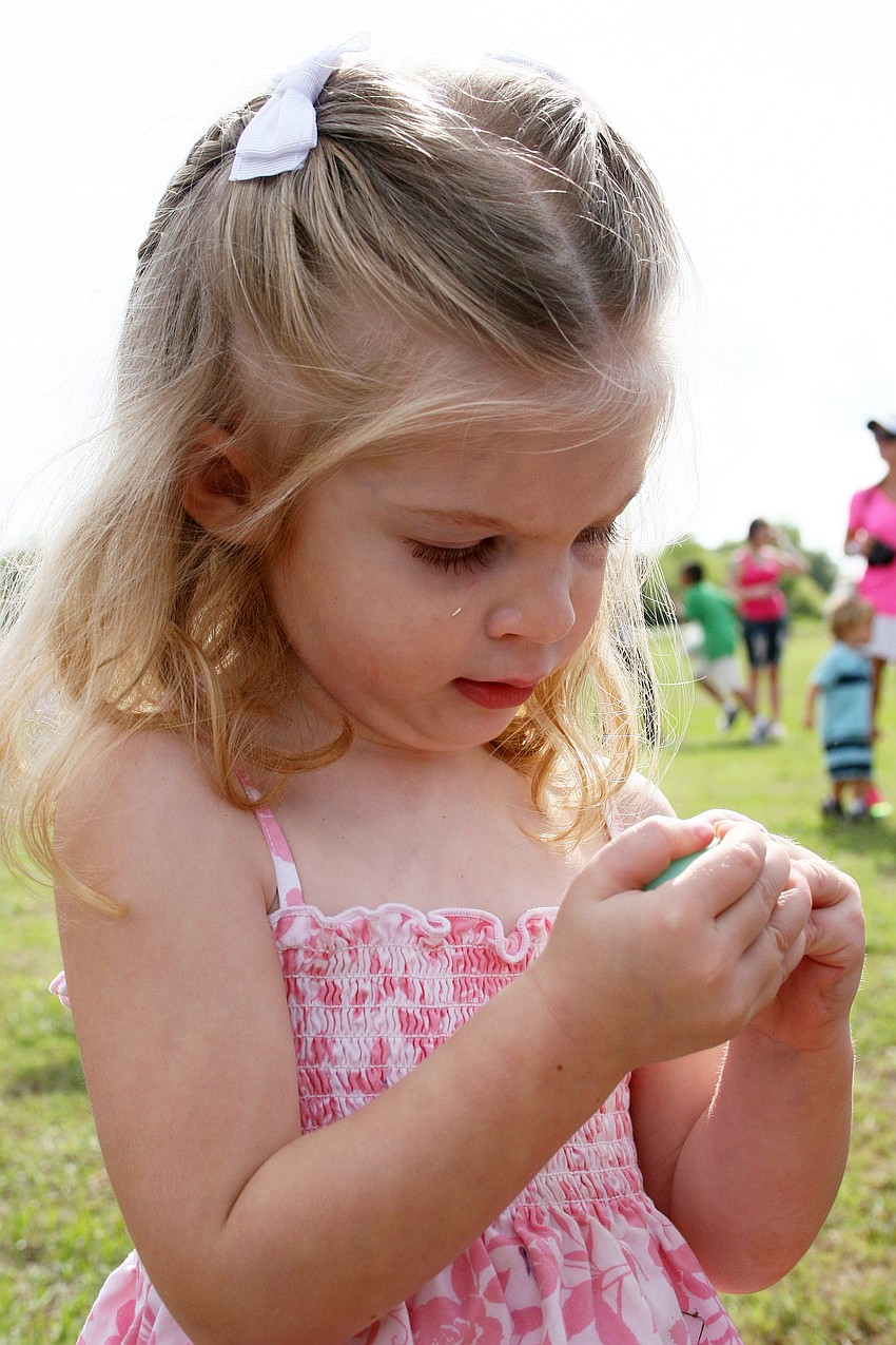 Allison Rothhaar, 2, examined each one of her eggs carefully.