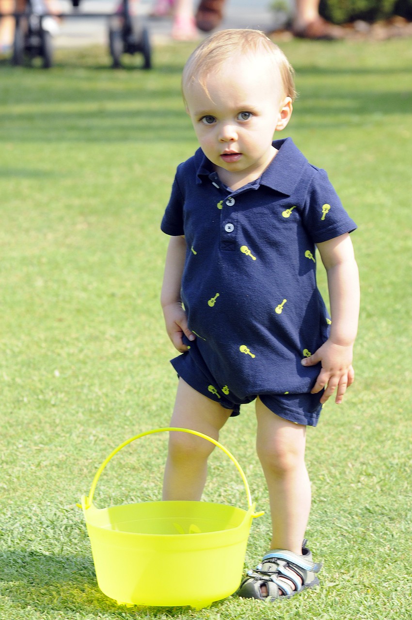 Sixteen-month-old Mason Blundell spent most of his first egg hunt playing with his Easter basket.