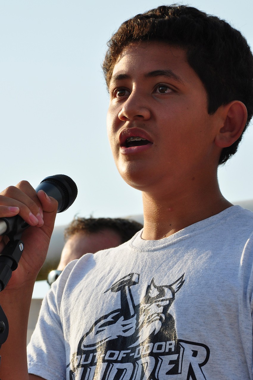 Solo Matelau, 13, performed the national anthem.