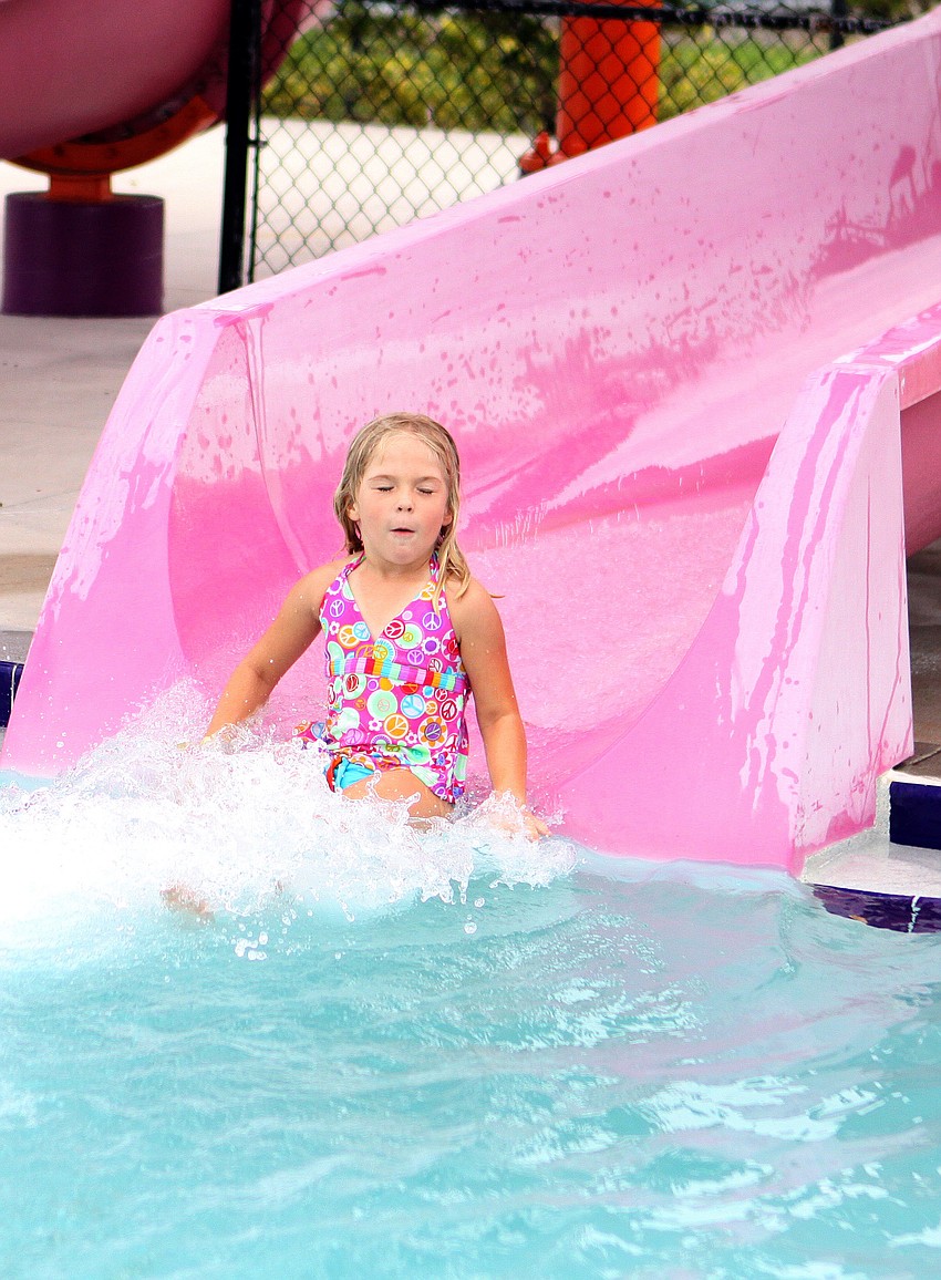 Hailee Canfield, 5 Â½, closes her eyes and holds her breath as she makes her way down the water slide.