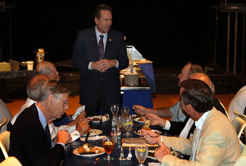 Congressman Vern Buchanan talks to some of the Kiwanis Club members, Friday, April 20.
