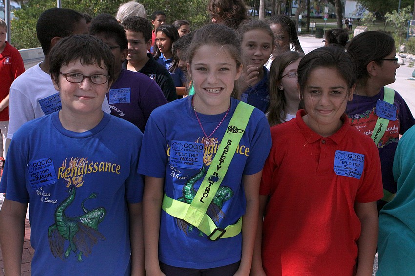 Mason Coburn, 12, Nicole Hurter, 11, and Sabrin Fausugh, 11, from Gocio Elementary enjoyed touring the Embracing Our Differences art exhibit.