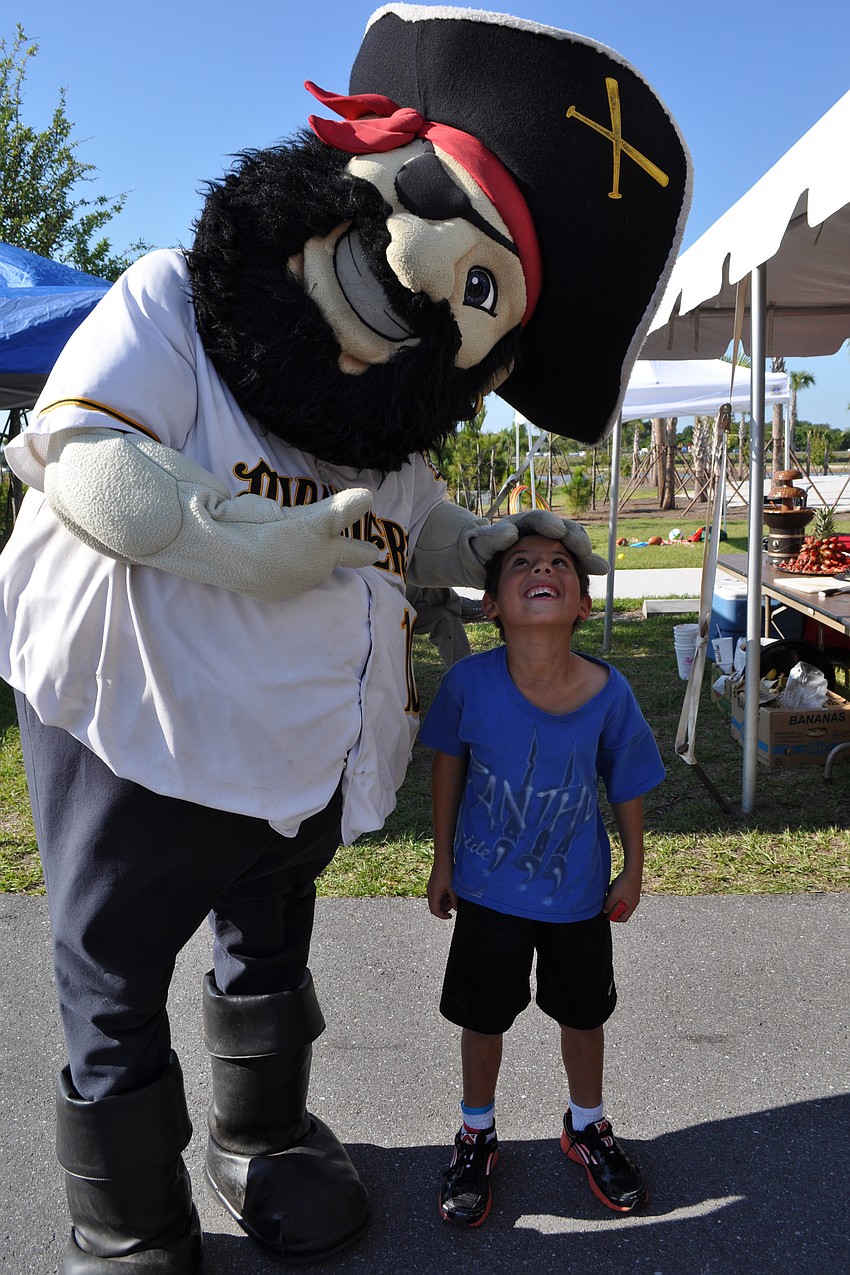 Ashton Hoy, 8, couldn't resist a chance to meet the Braden Marauder's mascot.