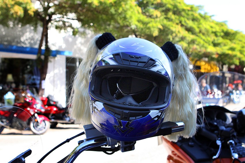 A fun helmet with blonde pig tails was placed on the handle bars of a motorcycle on Main Street, Sunday, Jan. 8, at Thunder by the Bay.