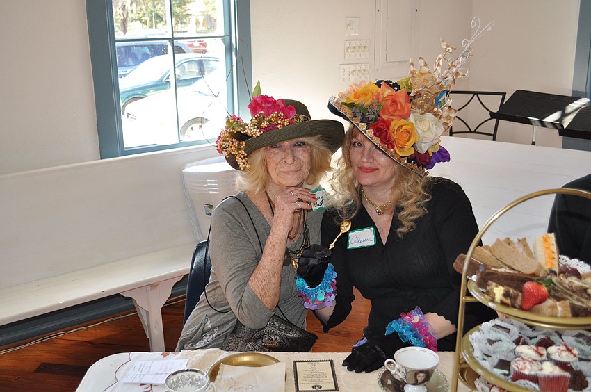 January Eldred and Cathie Carol Zurich-Wus show off their fancy hats.