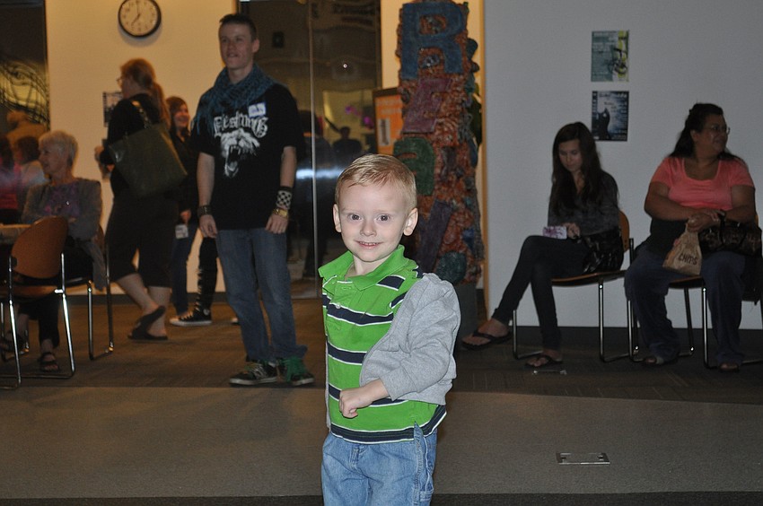 Afton Crenshaw	busts a move during a performance by The Garbage Men.