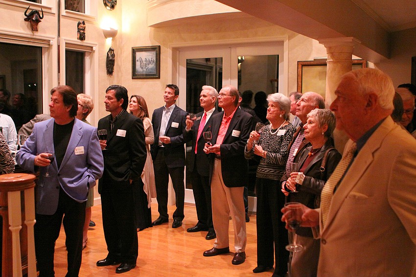 People turned their attention toward the landing inside the Frostad's home to see what shows would be done for the Players Theatre 83rd Season.