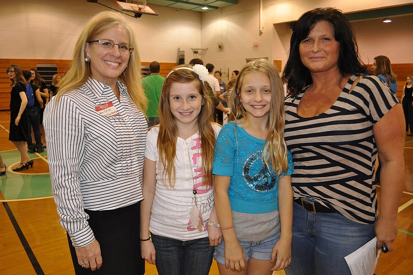 Alicia Collins and her daughter, Madison, caught up with friends, Jovana and Cheryl Eddinger.