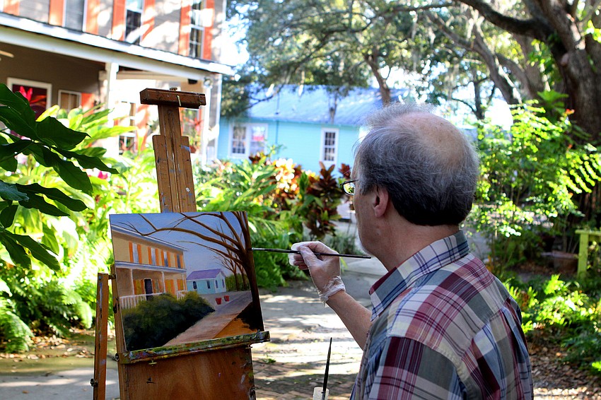 Paul Boivin, from Ottawa, CAN., paints a scene Thursday, Jan. 12, in Towles Court with the rest of the Plein Air Sun Coast artists.