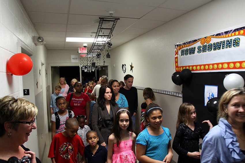The crowd makes their way into the hallway by the 5th grade classrooms, Thursday, Jan. 12, in order to attend the 5th grade Documentary Film Fest at Phillippi Shore Elementary.