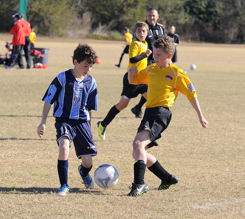 West Florida Premierâ€™s Christian Giordano and Ben Soto of the Lakewood Ranch Chargers battle for the ball.