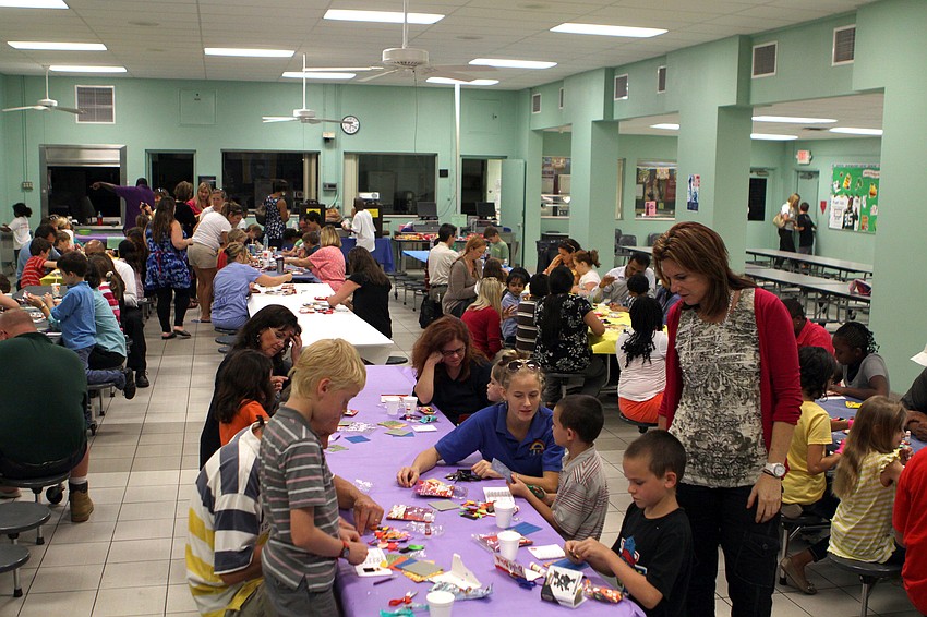 Students and parents work together to create their very own books during the Build a Book event, Wednesday, Jan. 25, at Bay Haven Elementary.