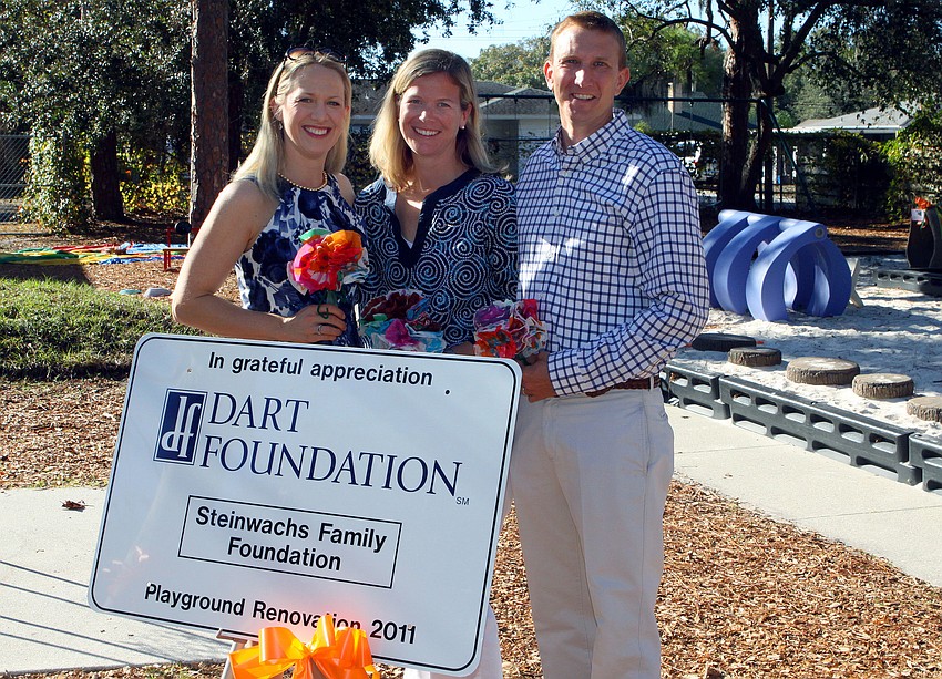 Ariane Dart of the Dart Foundation poses with Ellen and Jeff Steinwachs of the Steinwachs Family Foundation, Tuesday, Jan. 24, at Forty Carrots. The two foundations helped to renovate the two playgrounds at Forty Carrots.