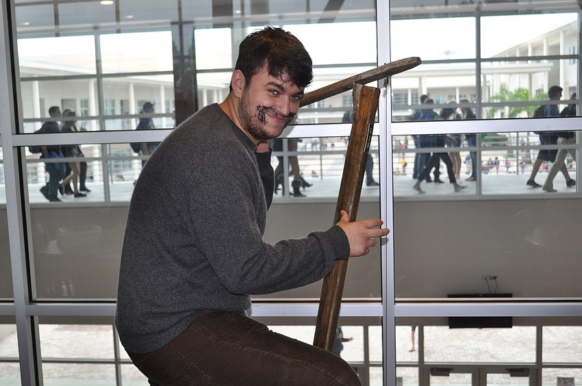 Christian Harris dressed as a musician character from the book, Cold Mountain.