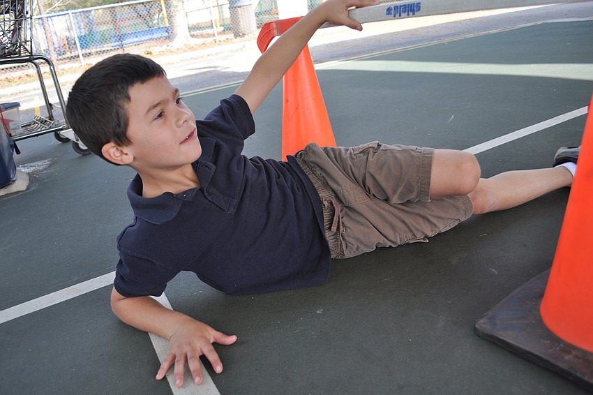 Weston Howard couldn't quite get low enough to crawl under a bar without knocking it off its post.