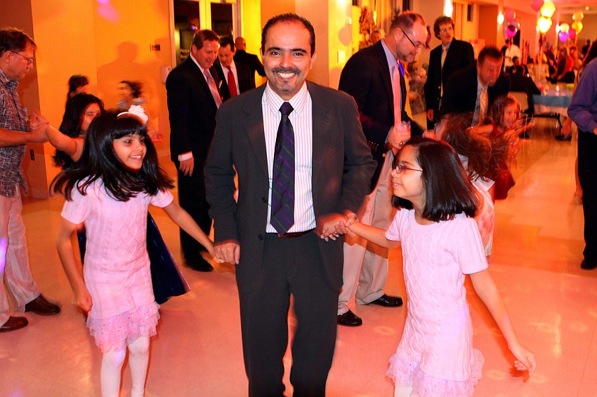 Miguel Barrales with his daughters Ximena and Begonia, 9