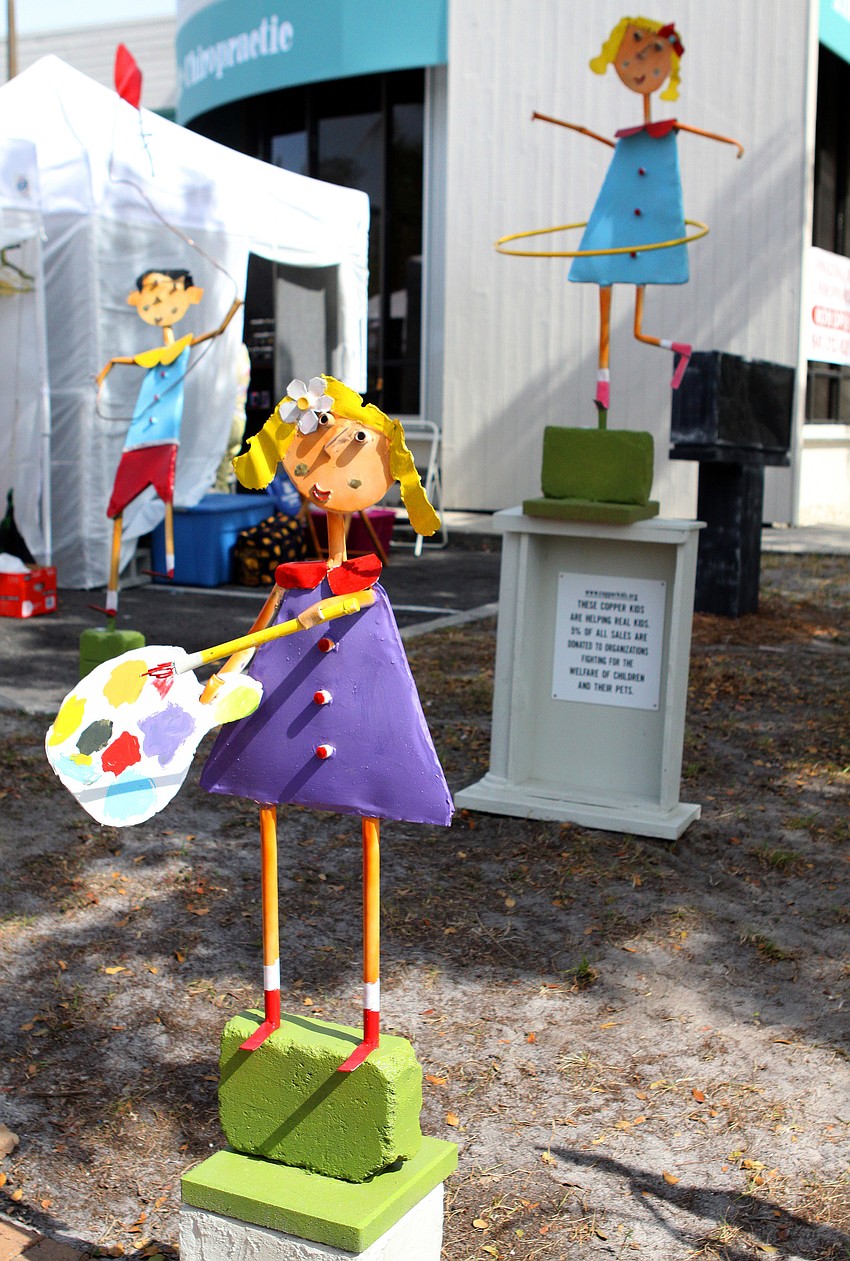 Sculptures of children playing were made out of copper and 5% of all sales are donated to organizations fighting for the welfare of children and their pets.