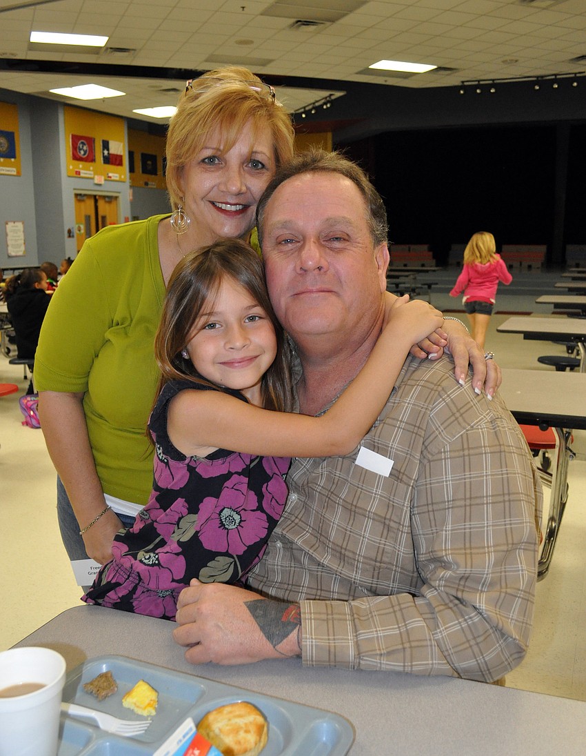 First-grader Hailee Bouchard-Serafine and her grandparents Dean and Terri Serafine were surprised when the bookmark she designed for the Grandparents Breakfast was one of the ones chosen to be handed out.