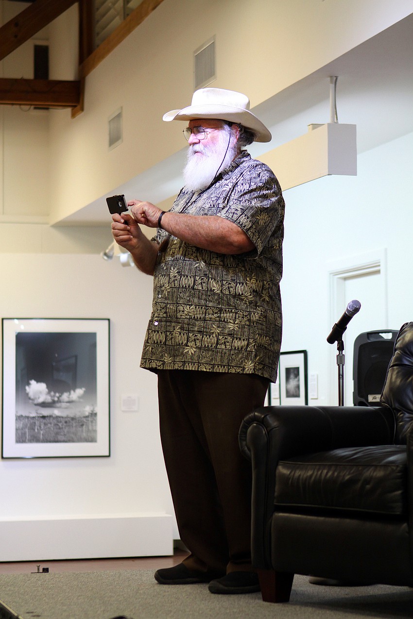 Clyde Butcher uses his wife's Iphone to take a photo of the crowd.