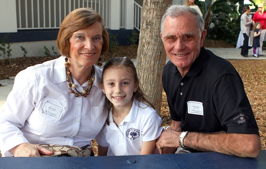 Marissa Govic, 7, poses with her grandparents, Agnes and Dusko Govic, Friday, Feb. 10, during Grandfriends Day at Out-of-Door Academy.
