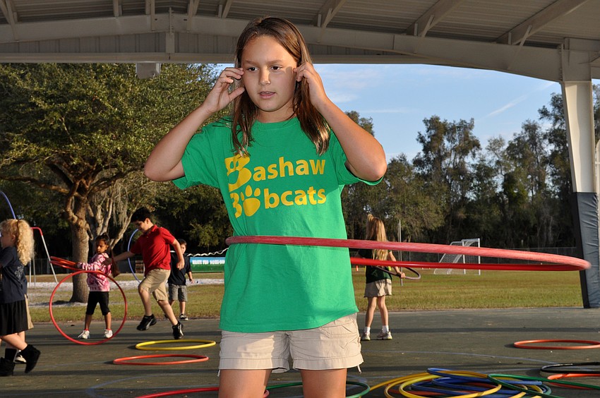 Nine-year-old Gracie Bourzac was one of the first ones to grab a hula-hoop.