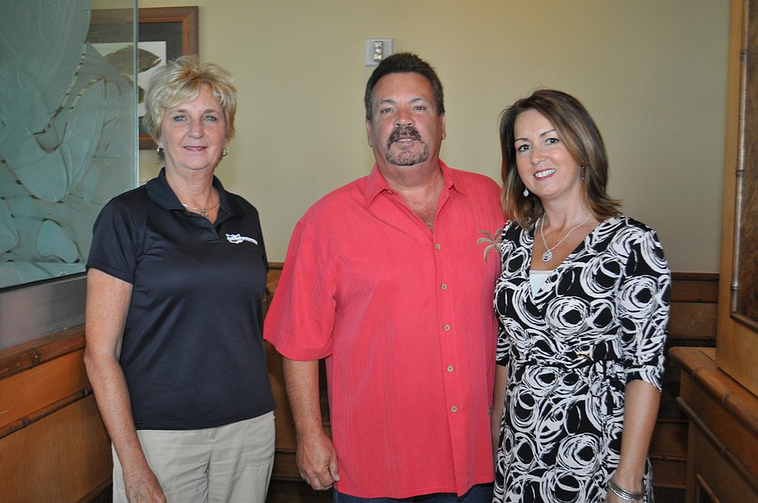Sandee Davis with Grimefighters, Richard Nicoletti with R&R Heating and Cooling Inc., and Denine Kavany with R&R Heating and Cooling