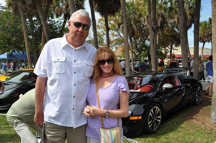 Russ and Marjorie Stroud in front of a Bugatti