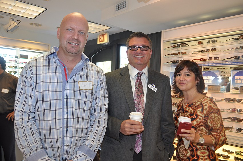 Matt Grover Co-Owner of Daquari Deck, and Ron Belyea and Laurie Gomes with the Herald Tribune Advertising department