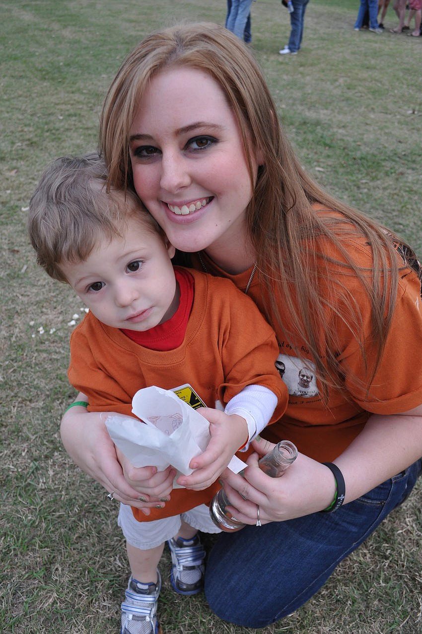 Evan Durrance, pictured with his mother, Alex, was intent on eating his popcorn.