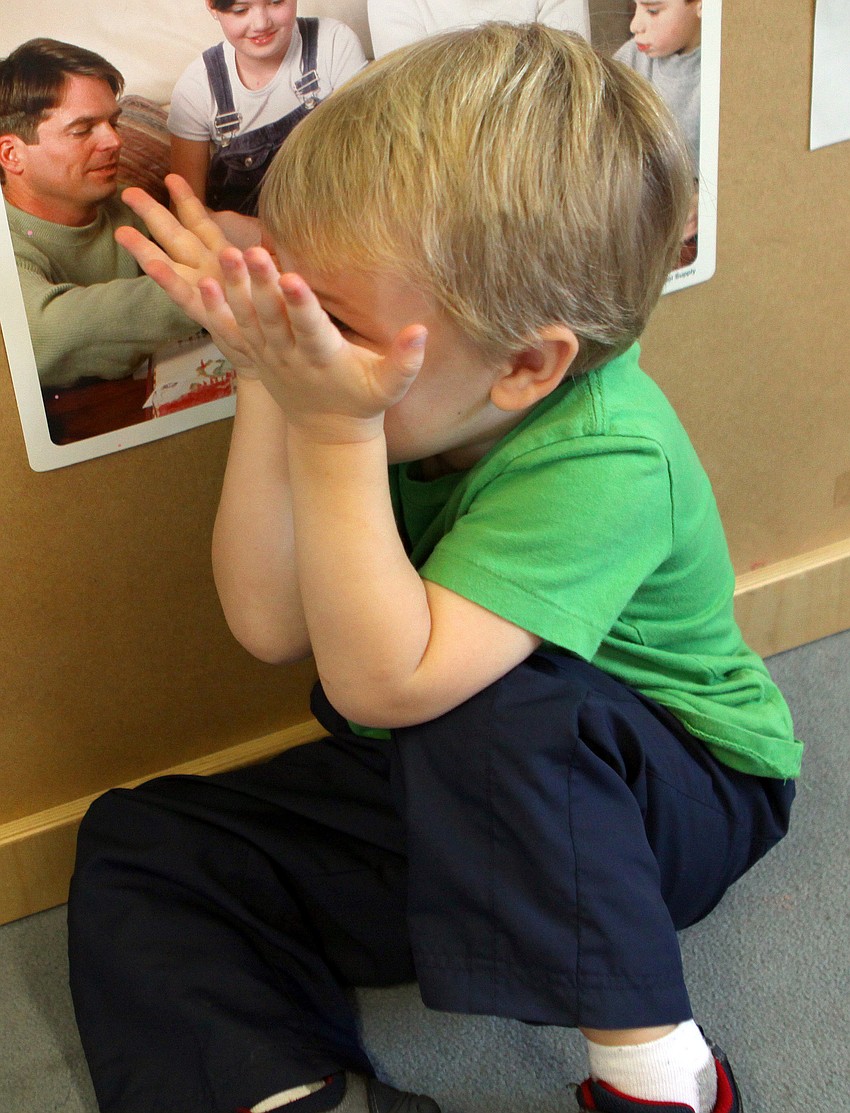Hayne Falck, 2, plays peek-a-boo, Monday, Feb. 27, at St. Boniface Preschool.