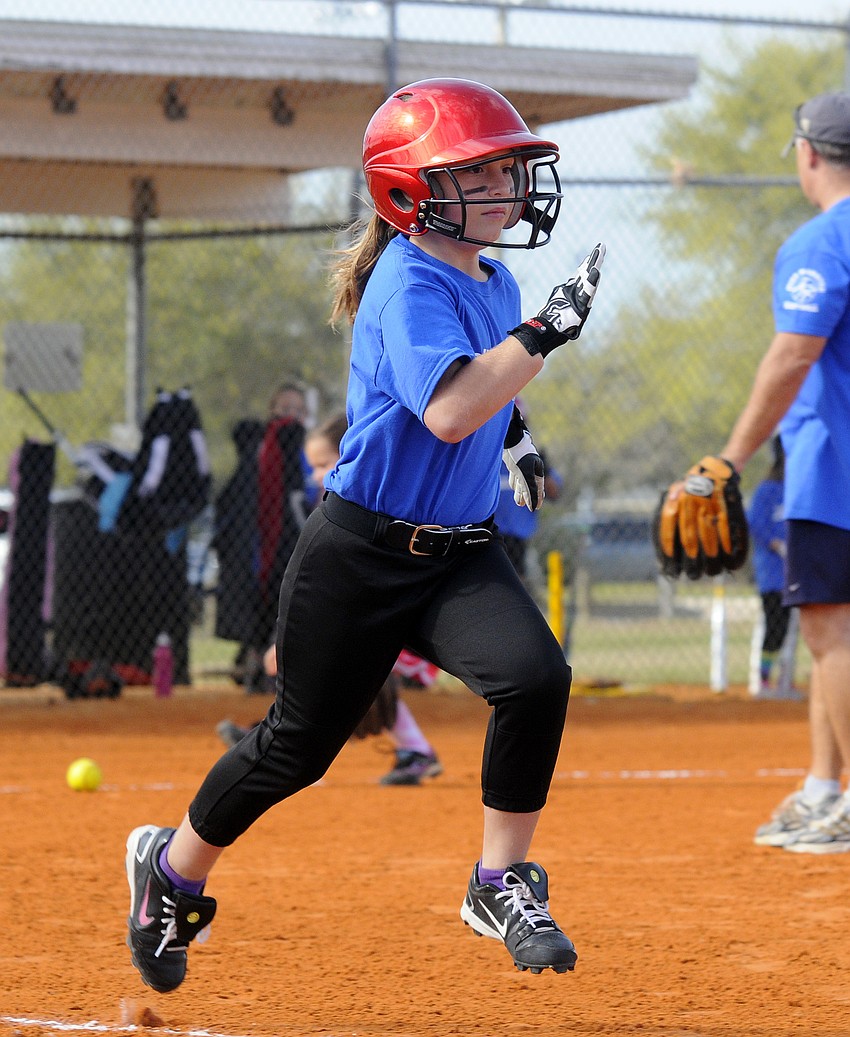 Jillian Herbst races down the first base line after hitting a single.