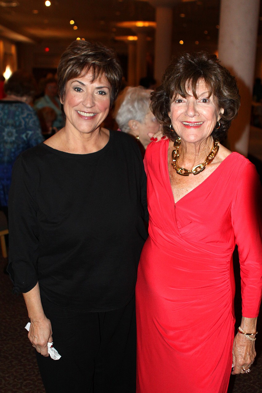 Linda Piro, one of the models, and Shirley Cuozzo, the narrator for the fashion show.