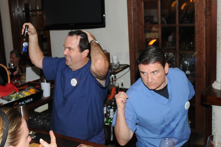 Dr. Alan Glover and Dr. Joseph Noah were bartenders.