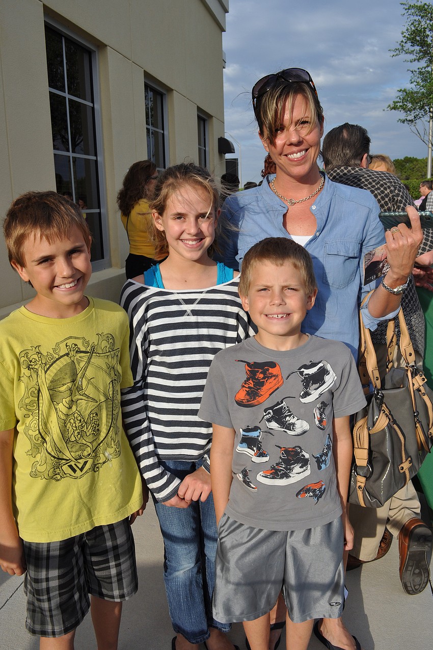 Joy Yohn, with her children, Christian, Camryn and Joshua, checked out the animals brought by Big Cat Habitat.