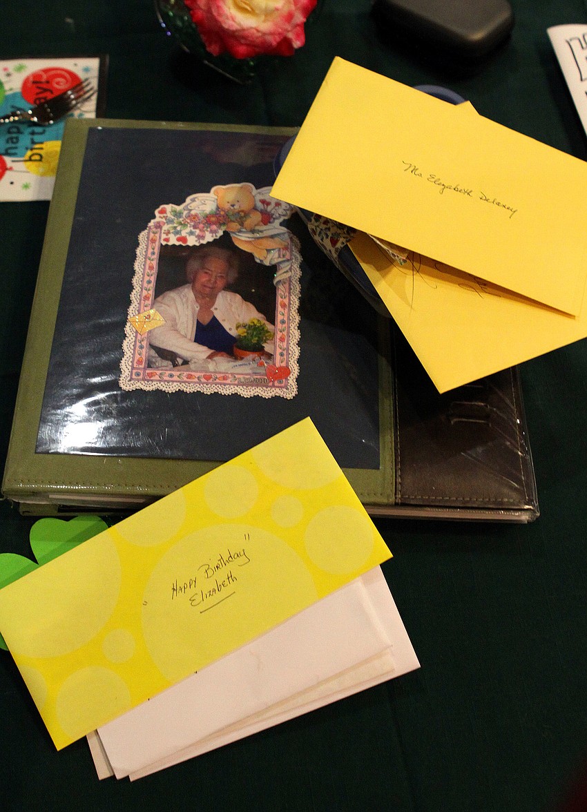A scrapbook of Elizabeth Delaney's life was on a table surrounded by plenty of birthday cards, Monday, March 12, during her birthday party at the Senior Friendship Center.