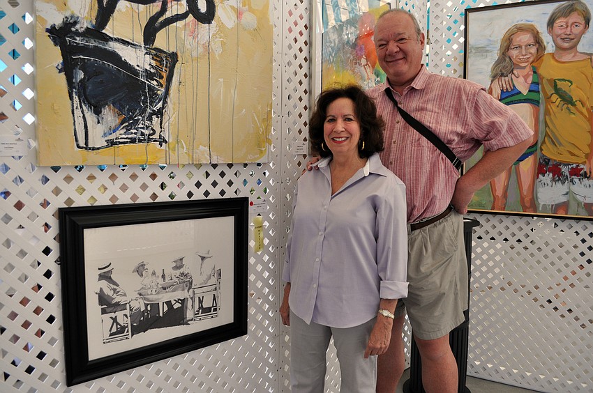 Lakewood Ranch resident Toby Kline, pictured with her friend Pierre Vautravers, bought the drawing titled â€œLunch at the Polo Grounds.â€