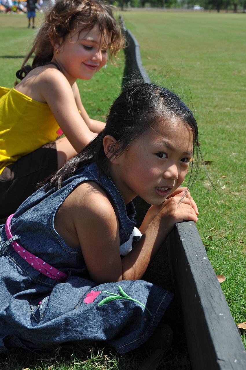 Christine Tagle, 5, eagerly watched the ponies go by.