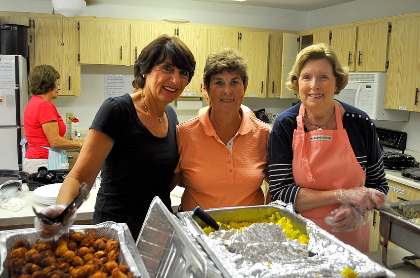 Sharon Holsinger, Carol Bauer and Rita Flannery helped to serve up Lent dinner, Friday, March 23, at St. Michael the Archangel.