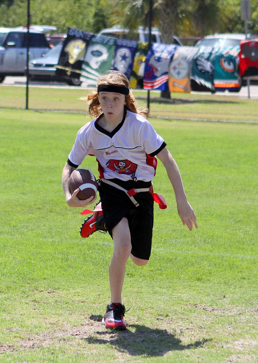 Zach Fairly, 11, makes his way down field during his NFL flag football game, Saturday, March 24, out at Glebe Park.