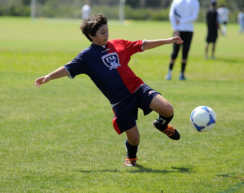 Christian Ruiz-Ashley attempts to keep the ball in play.
