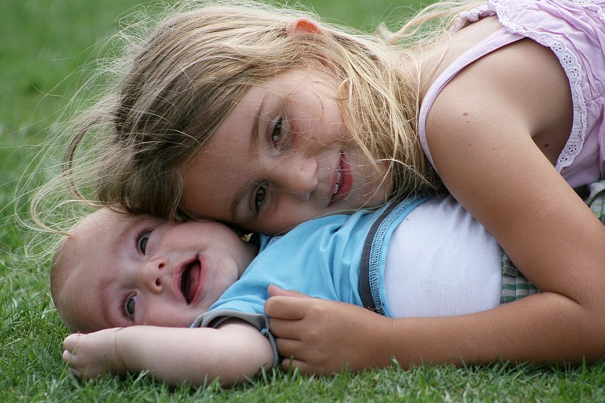 Sirelle Standor cuddled with baby brother Moa, 7 months.