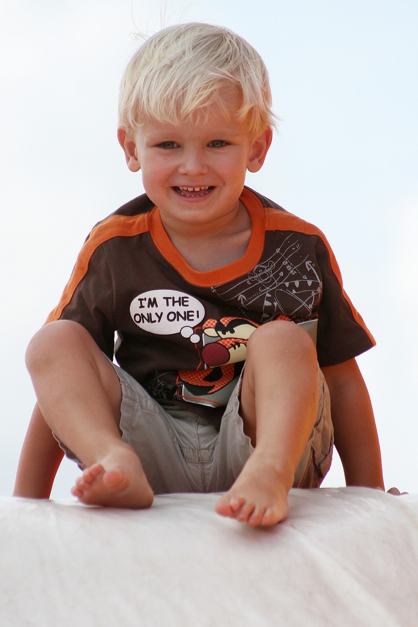 Nathan Bains, 2, couldnâ€™t wait to zoom down this inflatable slide.