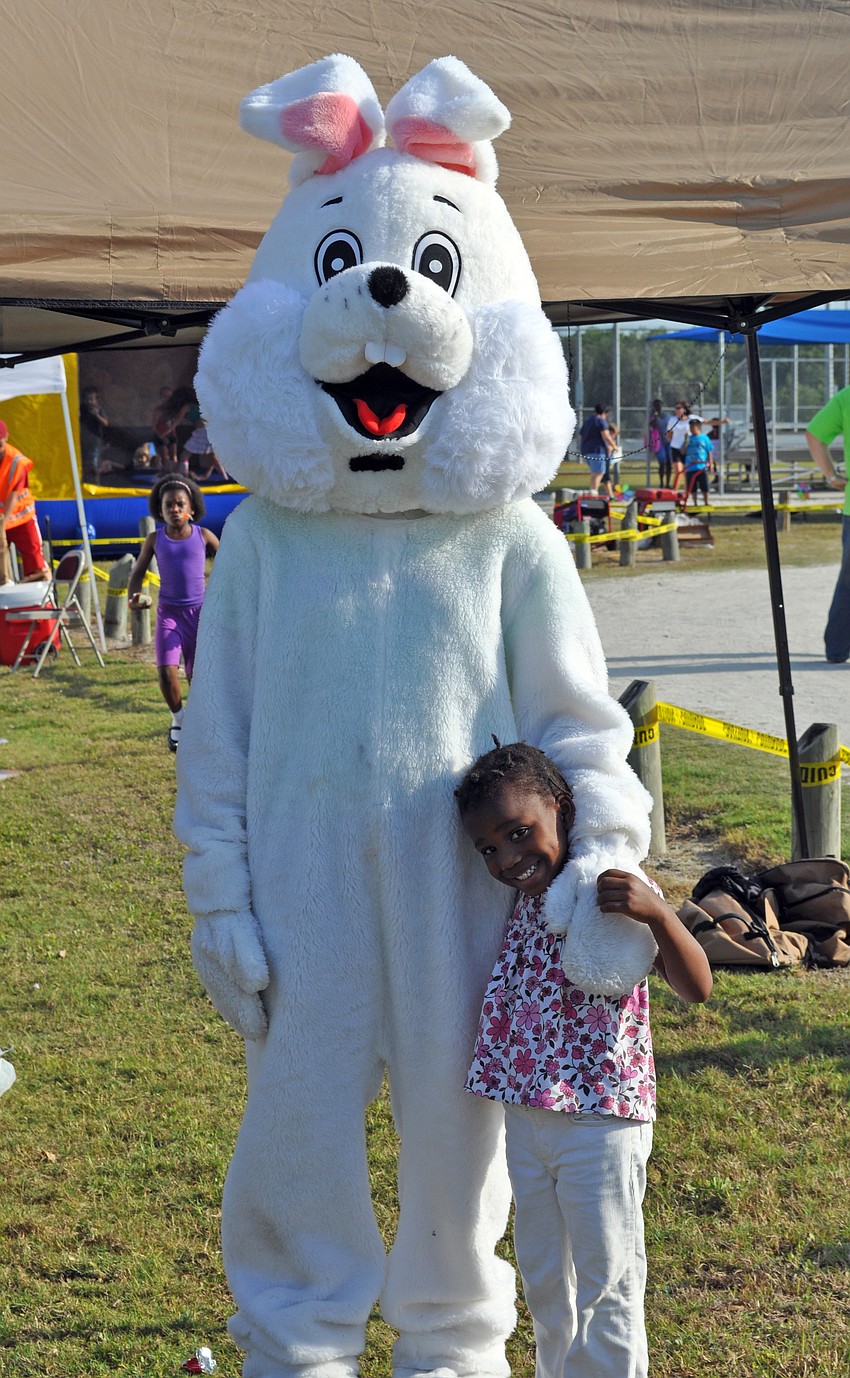 Three-year-old Ailjan Scott couldnâ€™t wait to get her picture taken with the Easter Bunny.