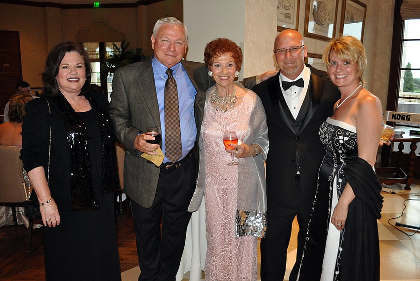 Sylvia Meyer of the Humane Society at Lakewood Ranch, center, tried to get Kathy and Don Sollie ad Tim and Kim Jotham to adopt dogs.