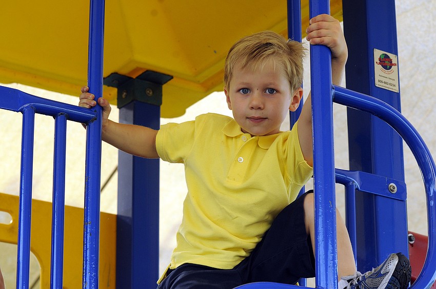 Four-year-old Cole Bowen found the perfect vantage point.