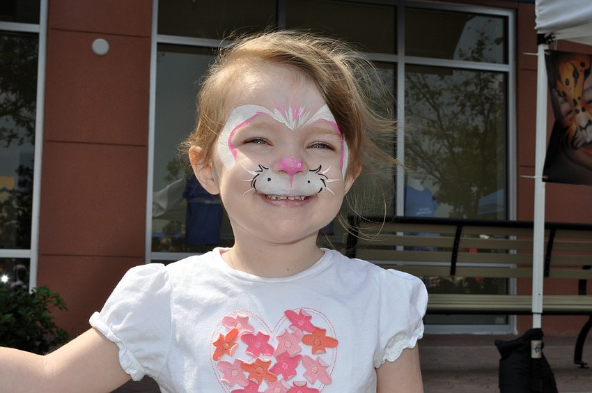 Three-year-old Jaclyn Grundy started off her first Easter egg hunt by getting her face painted like a bunny.